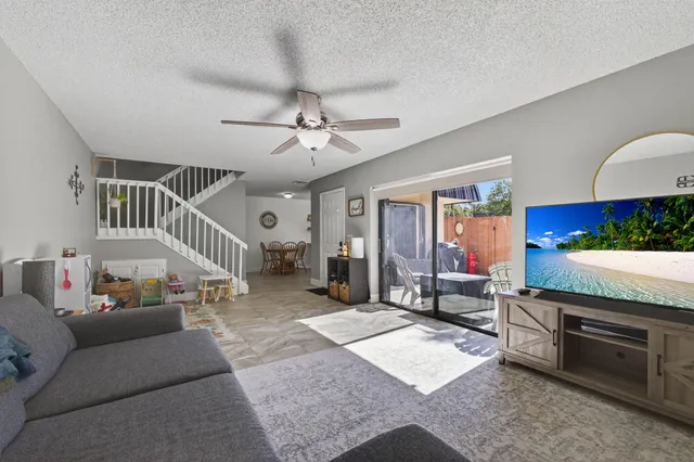 a view of livingroom with furniture and windows