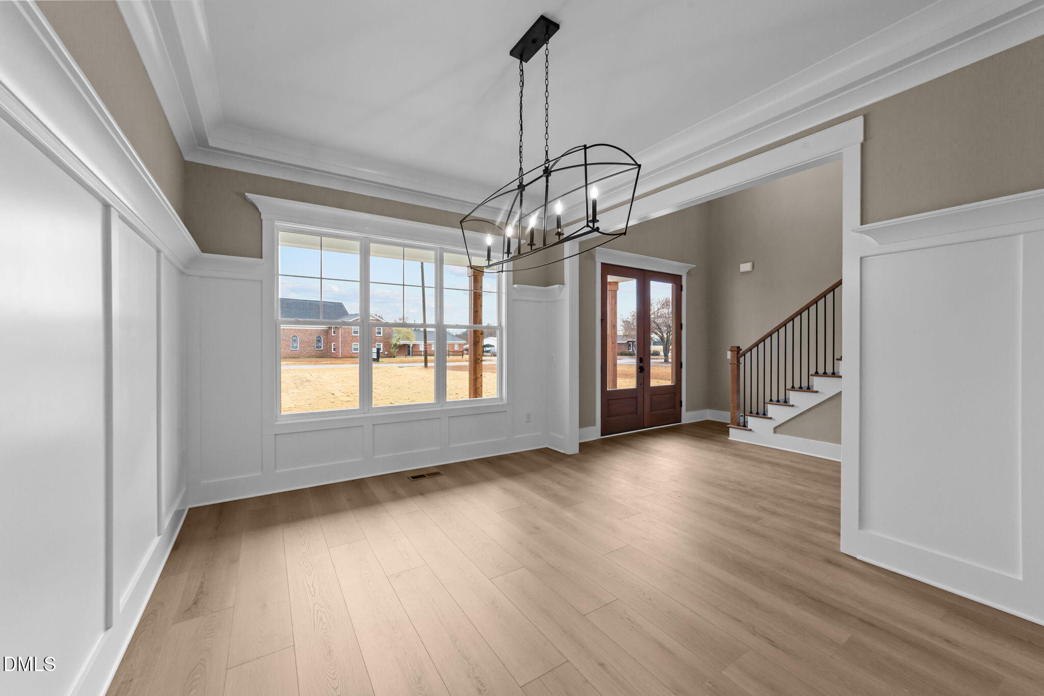 2590 Lassiter Road Four Oaks, NC 27524 - Photo 21 of 55 a view of empty room with wooden floor and fan