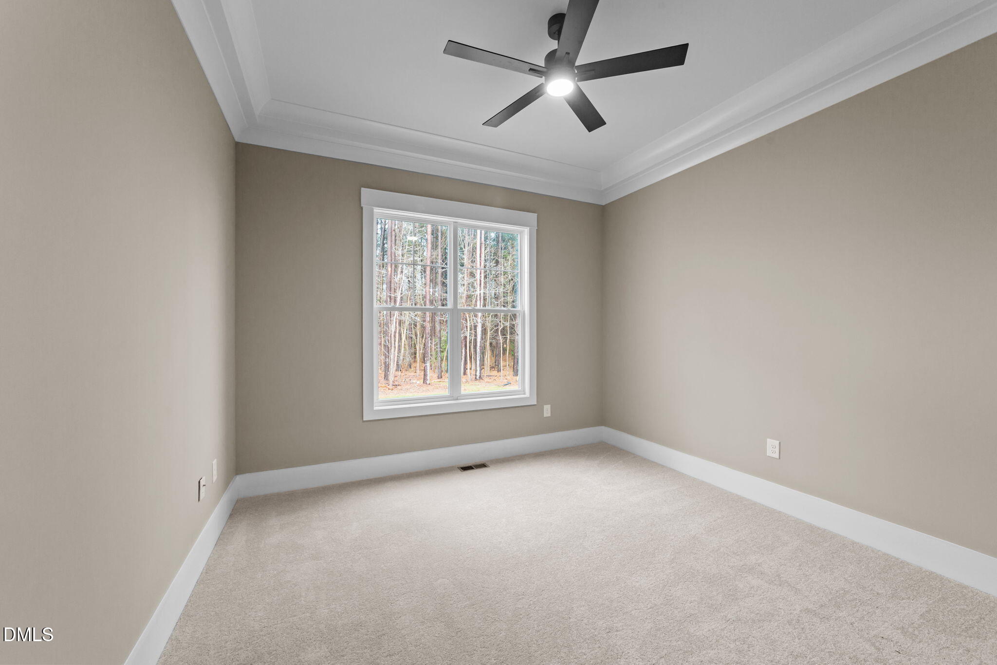 2590 Lassiter Road Four Oaks, NC 27524 - Photo 24 of 55 an empty room with a window and a fan