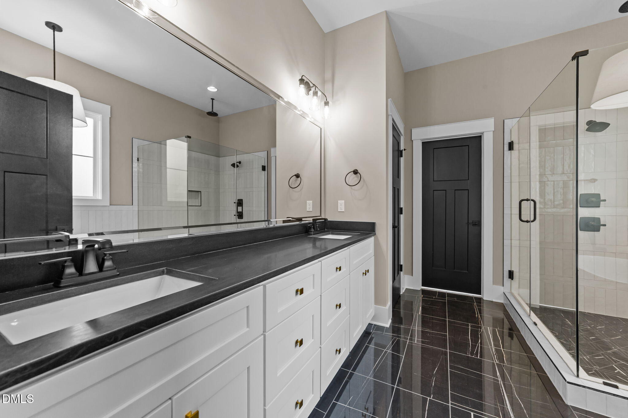 2590 Lassiter Road Four Oaks, NC 27524 - Photo 30 of 55 a bathroom with a double vanity sink and mirror