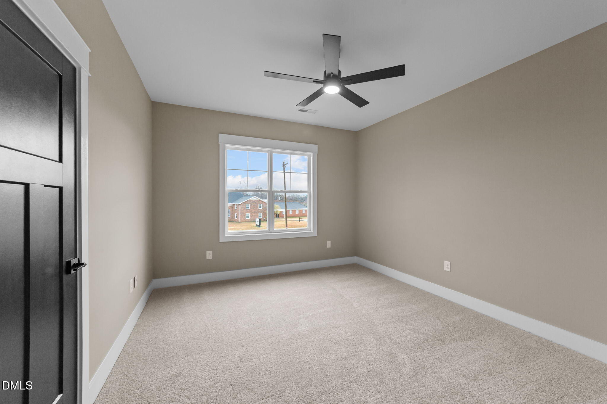 2590 Lassiter Road Four Oaks, NC 27524 - Photo 33 of 55 an empty room with windows and fan