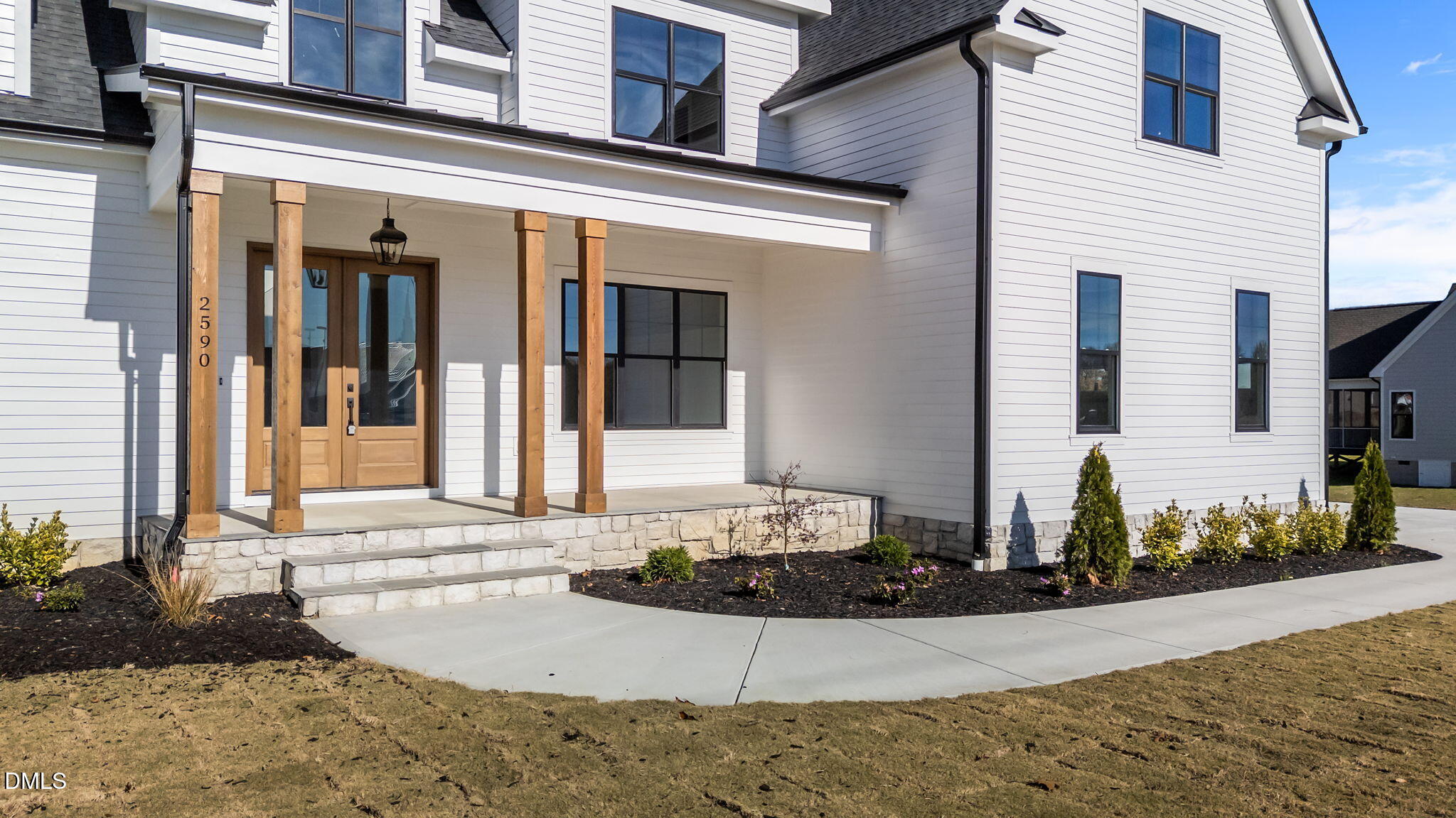 2590 Lassiter Road Four Oaks, NC 27524 - Photo 4 of 55 a front view of a house