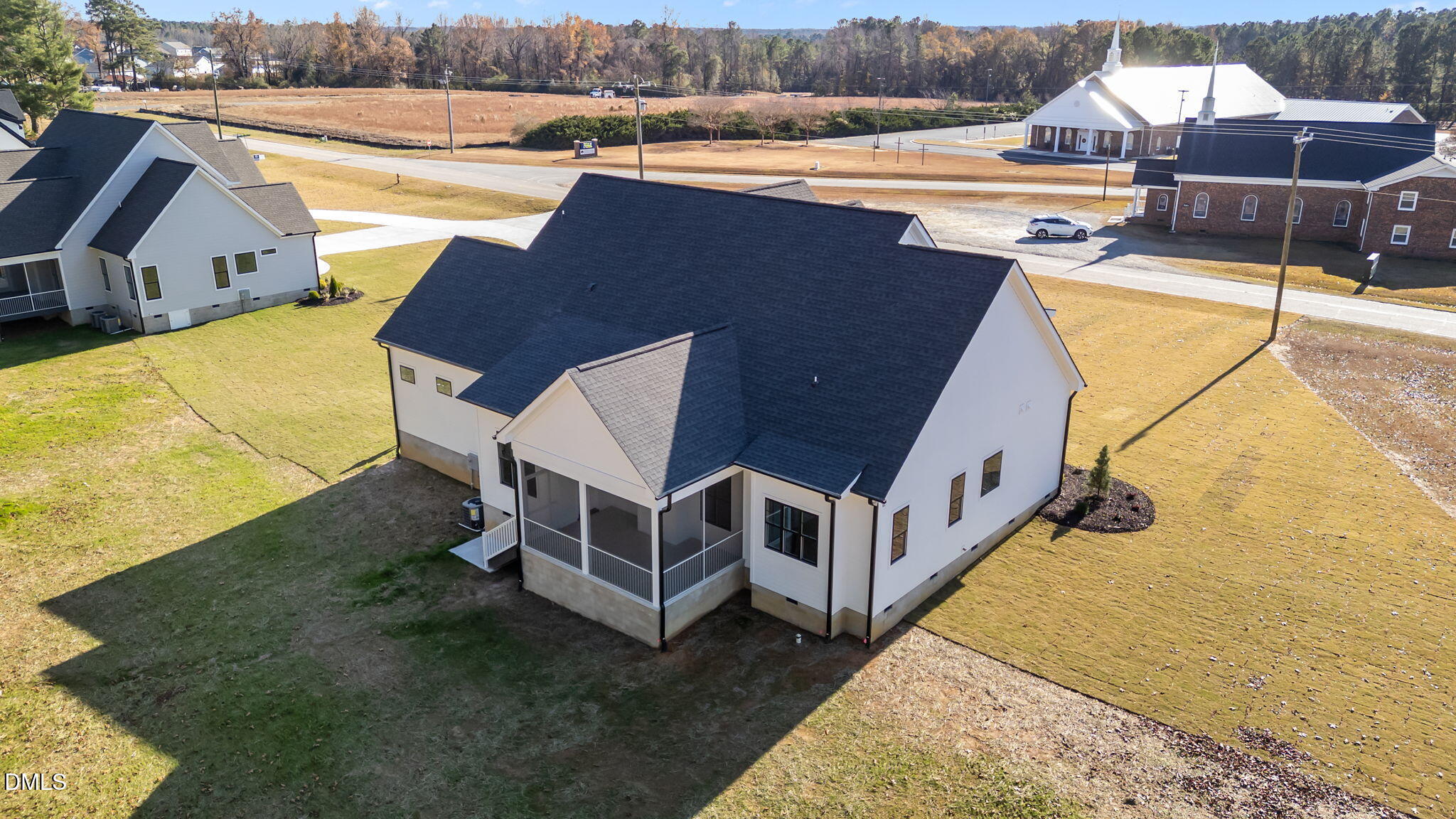 2590 Lassiter Road Four Oaks, NC 27524 - Photo 51 of 55 a view of a house with pool and chairs