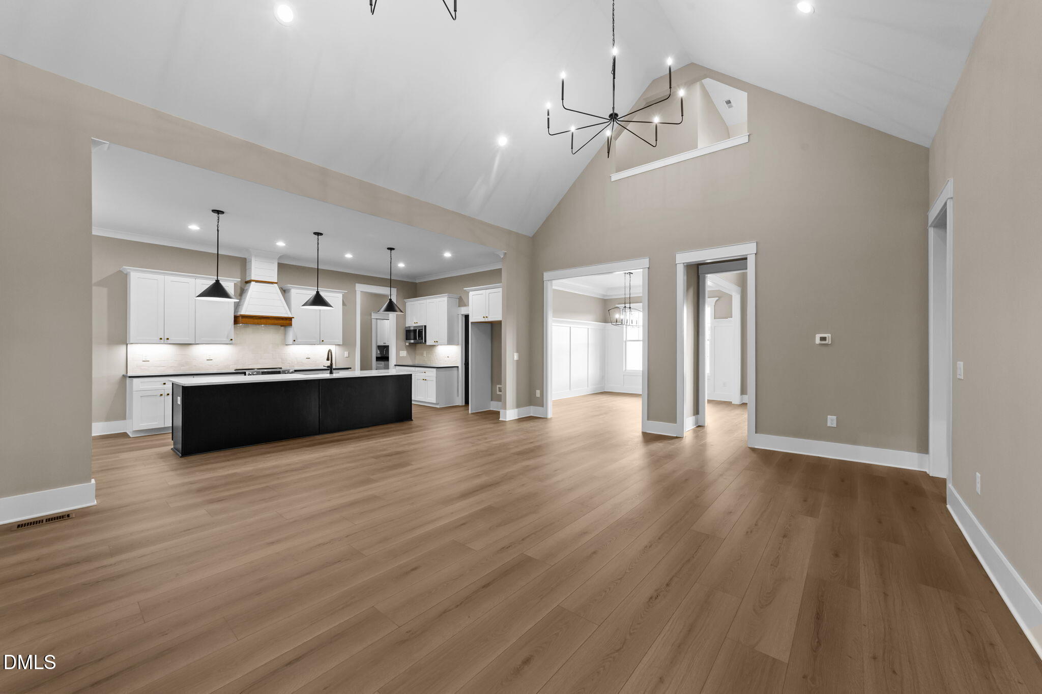 2590 Lassiter Road Four Oaks, NC 27524 - Photo 10 of 55 a view of a kitchen with a sink dishwasher a stove and kitchen view with wooden floor