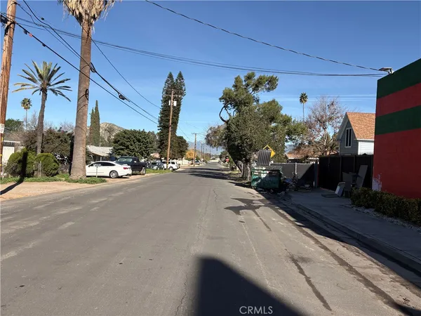 a view of a street with a building in the background
