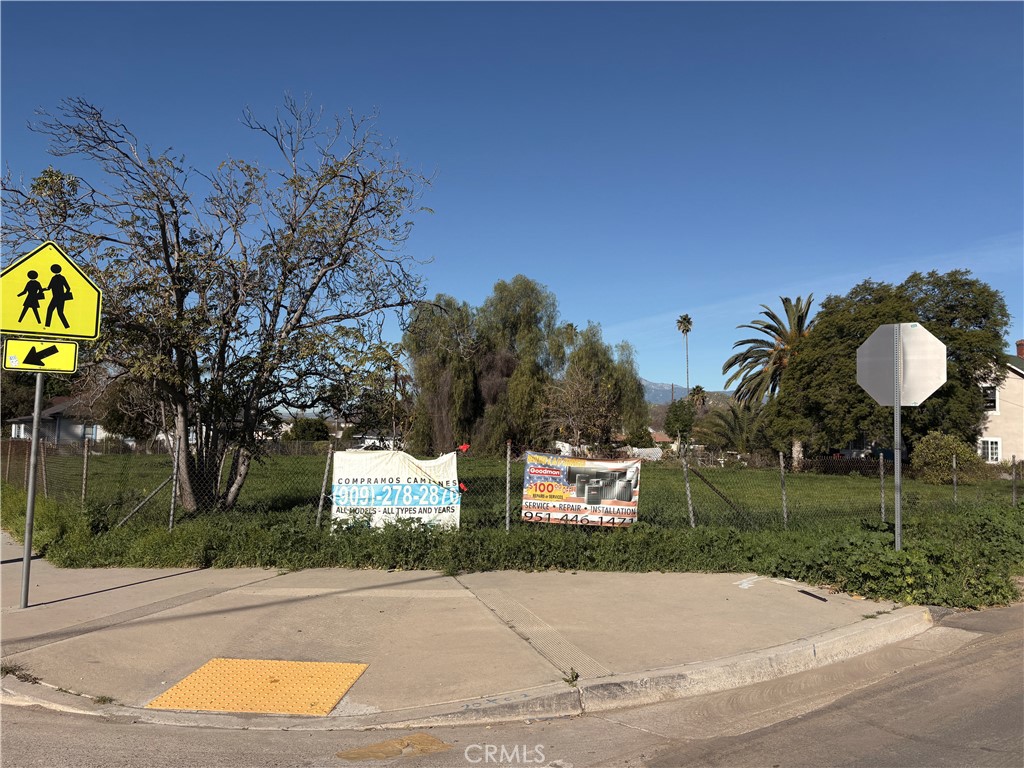 257 Highland Avenue Riverside, CA 92507 - Photo 8 of 15 a front view of a house with a yard and a garage