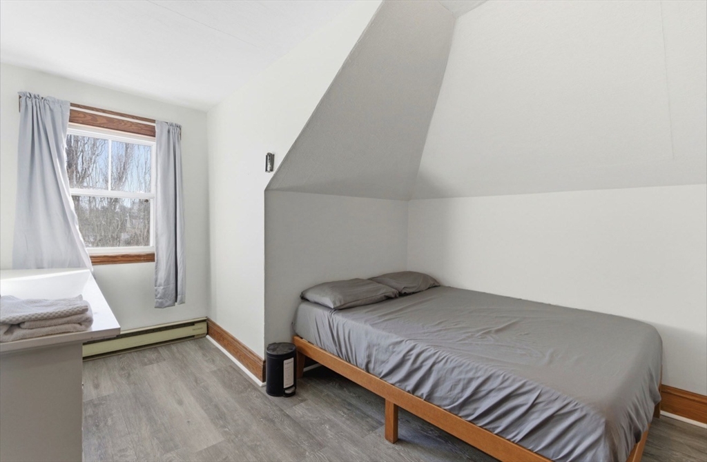 20 Central Avenue Danvers, MA 01923 - Photo 12 of 21 a bedroom with a bed and wooden floor