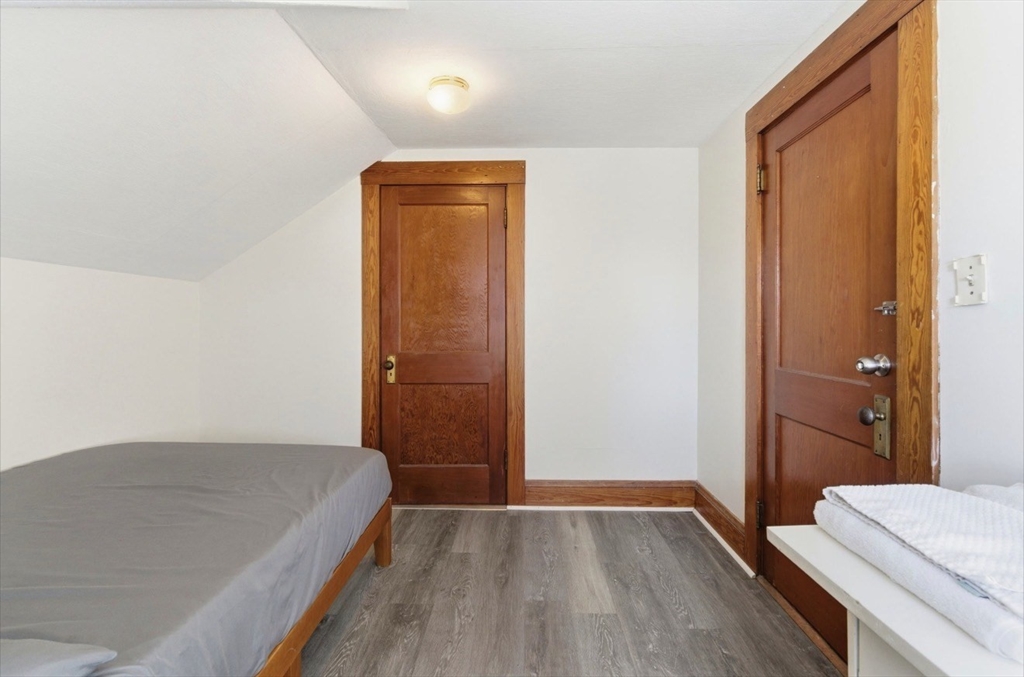 20 Central Avenue Danvers, MA 01923 - Photo 13 of 21 a bedroom with a bed and wooden floor