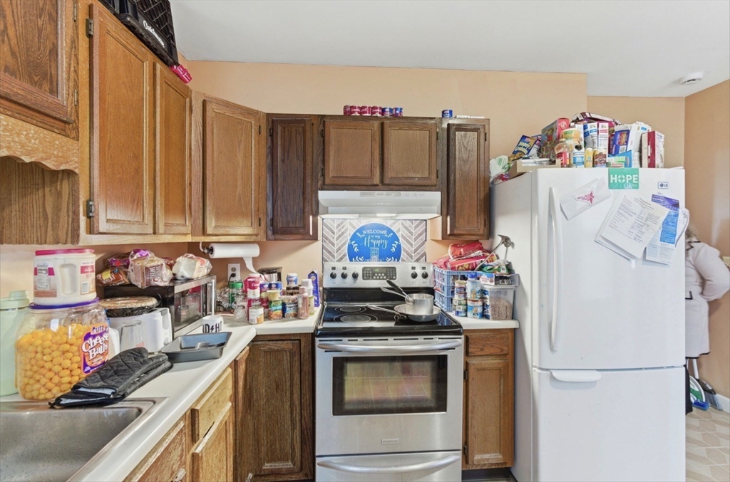20 Central Avenue Danvers, MA 01923 - Photo 3 of 21 a kitchen with refrigerator and cabinets