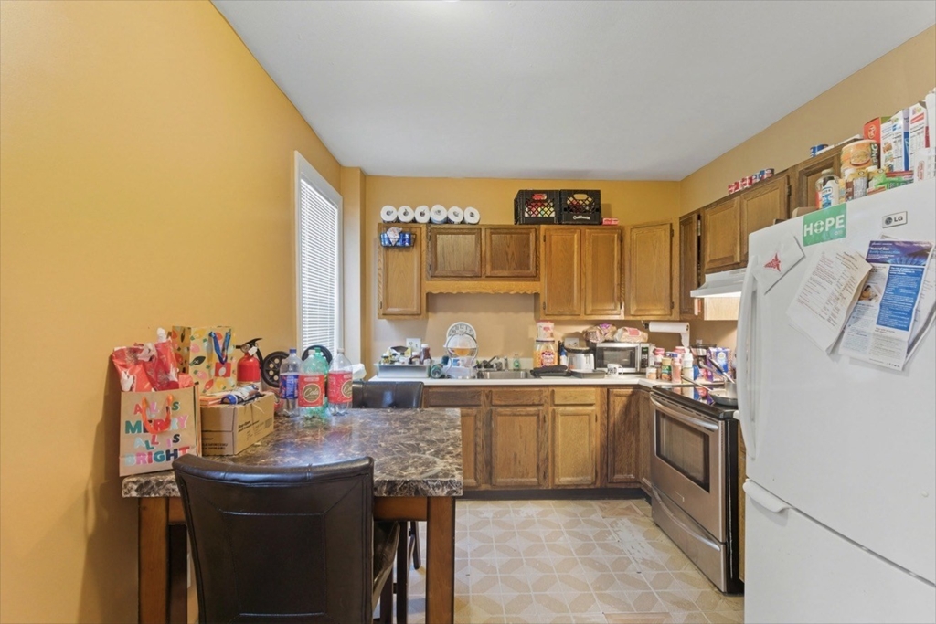 20 Central Avenue Danvers, MA 01923 - Photo 4 of 21 a kitchen with a sink and cabinets