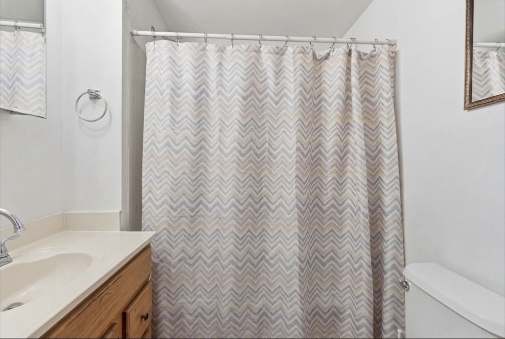 20 Central Avenue Danvers, MA 01923 - Photo 7 of 21 a bathroom with a granite countertop sink and a mirror