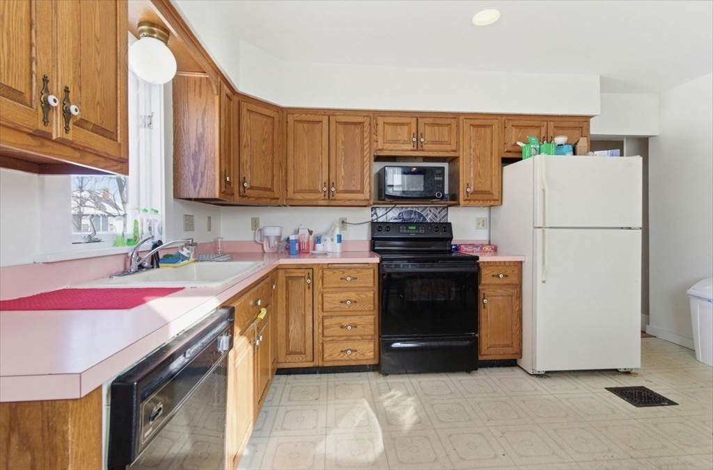 20 Central Avenue Danvers, MA 01923 - Photo 8 of 21 a kitchen with a sink stove and refrigerator