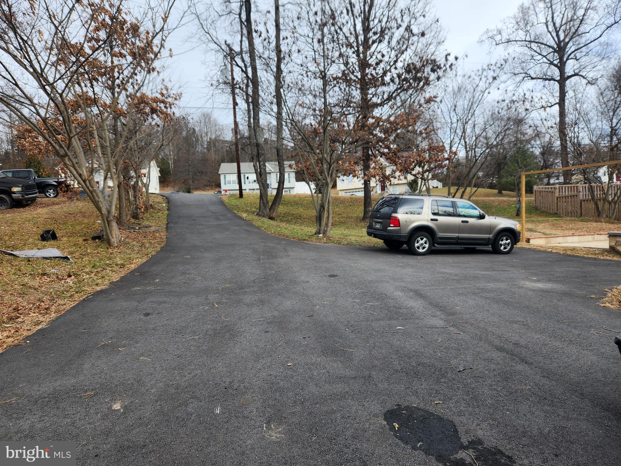 a view of street with parked cars