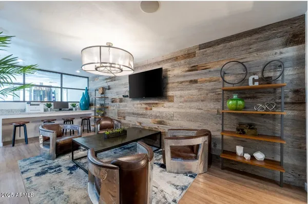 a living room with fireplace furniture and a flat screen tv