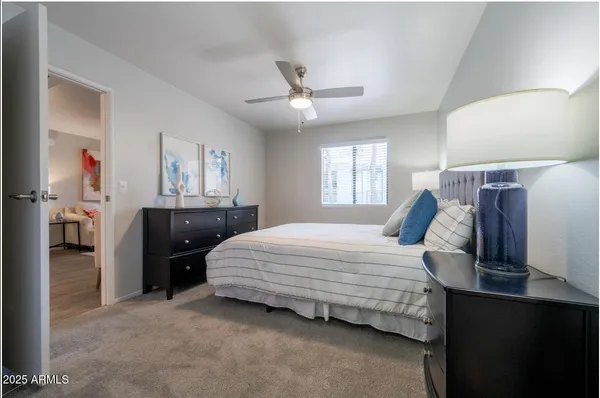 a bedroom with a bed and a closet