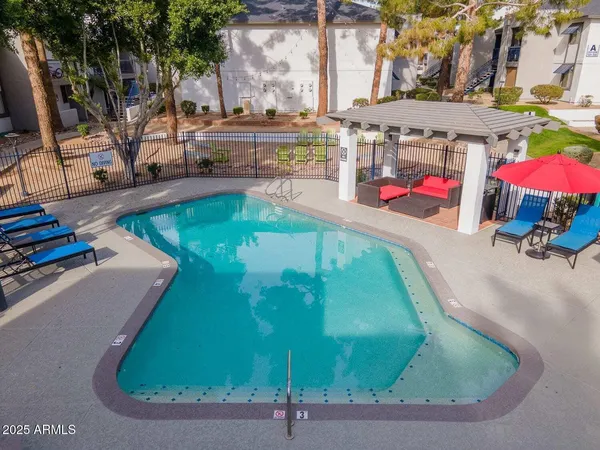 a view of a swimming pool with a sitting area