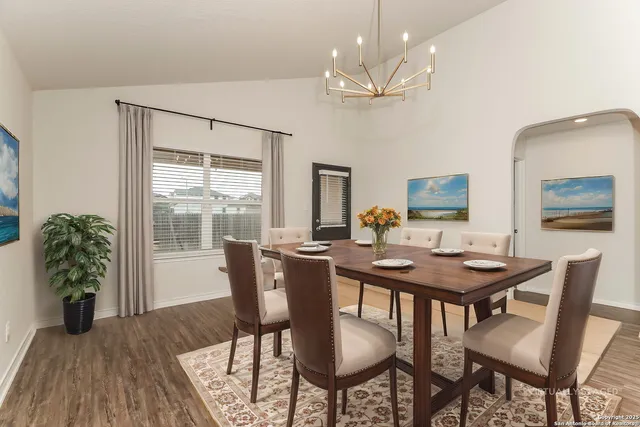 a view of a dining room with furniture window and wooden floor