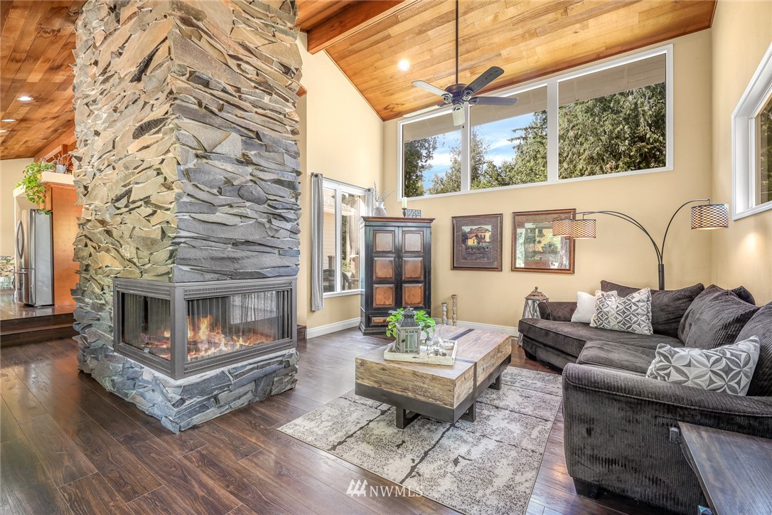 2287 East Hemmi Road Bellingham, WA 98226 - Photo 18 of 35 a living room with furniture and a fireplace