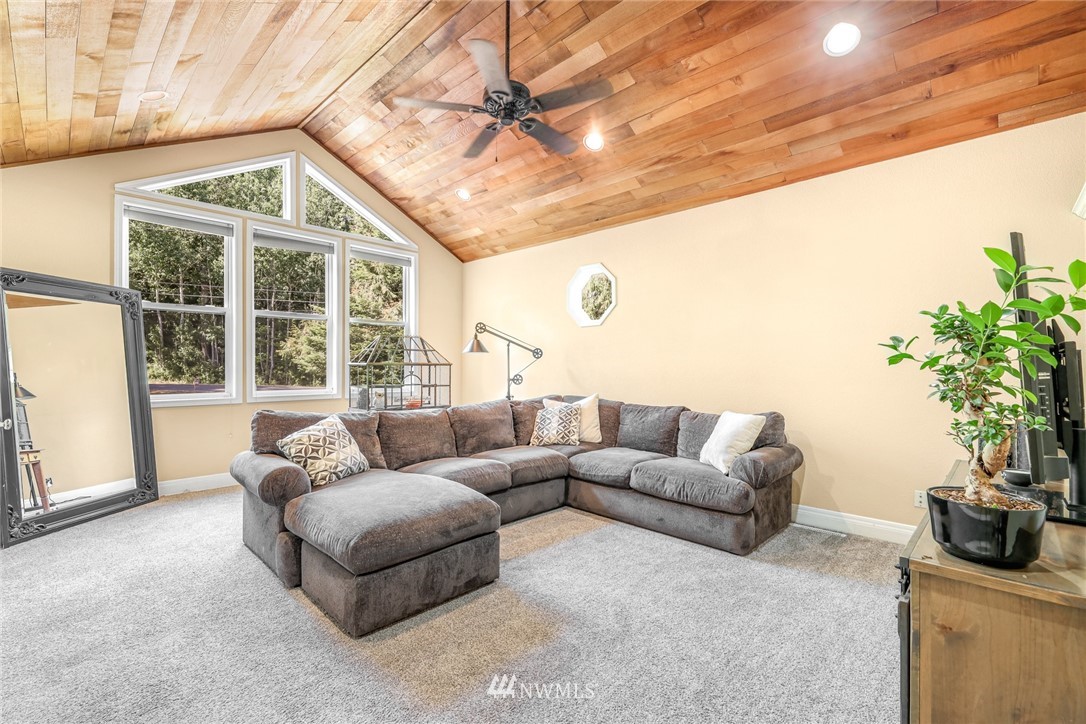 2287 East Hemmi Road Bellingham, WA 98226 - Photo 24 of 35 a living room with furniture and a large window