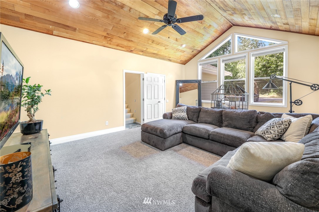 2287 East Hemmi Road Bellingham, WA 98226 - Photo 25 of 35 a living room with furniture and a flat screen tv