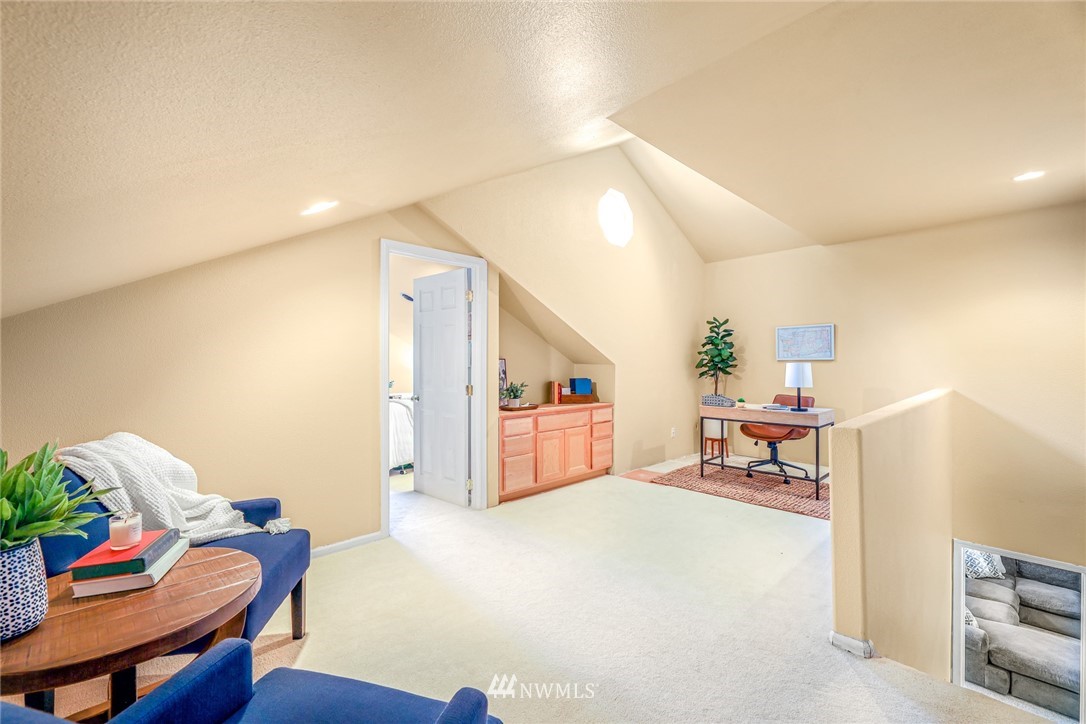 2287 East Hemmi Road Bellingham, WA 98226 - Photo 27 of 35 a living room with furniture and a table