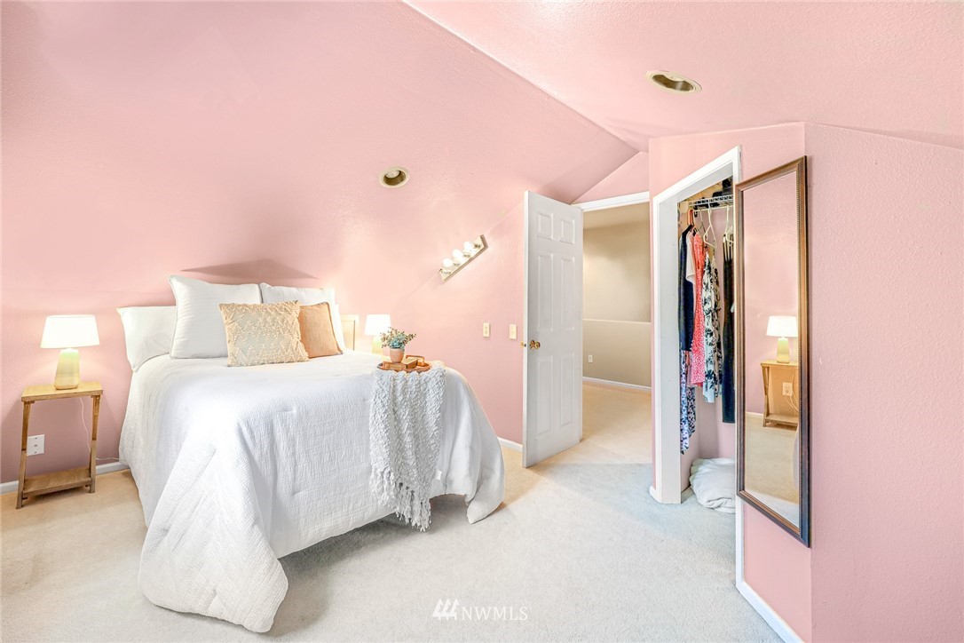 2287 East Hemmi Road Bellingham, WA 98226 - Photo 28 of 35 a bedroom with a bed and a mirror