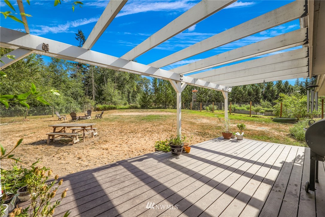 2287 East Hemmi Road Bellingham, WA 98226 - Photo 29 of 35 a view of a wooden deck with a yard