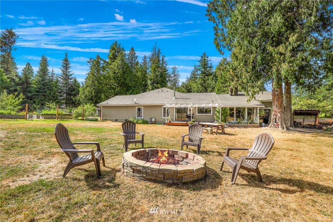 2287 East Hemmi Road Bellingham, WA 98226 - Photo 31 of 35 a view of a swimming pool and lounge chairs