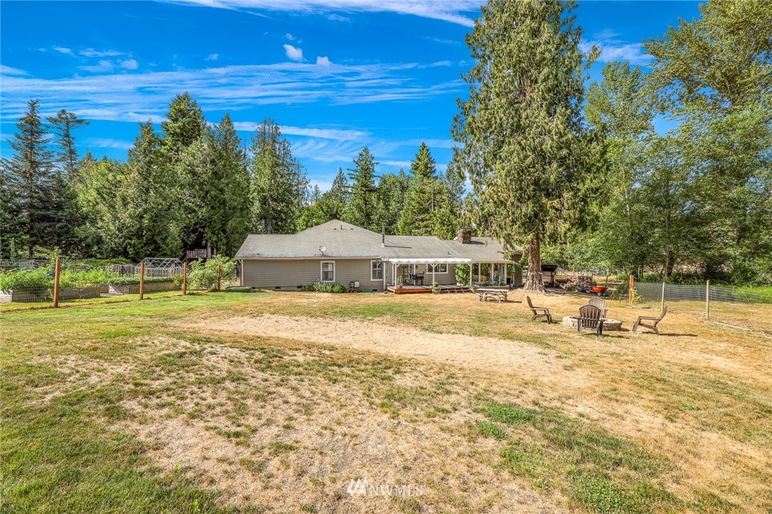 2287 East Hemmi Road Bellingham, WA 98226 - Photo 34 of 35 a view of a swimming pool with an outdoor space and seating area
