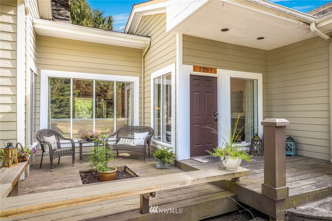 2287 East Hemmi Road Bellingham, WA 98226 - Photo 5 of 35 a front view of house with outdoor seating
