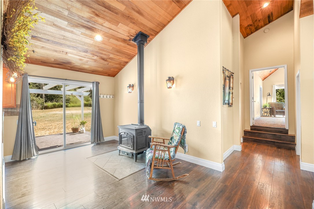 2287 East Hemmi Road Bellingham, WA 98226 - Photo 8 of 35 a view of a livingroom with furniture wooden floor and a rug