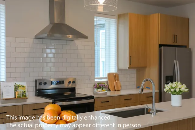 a kitchen with a stove and a wooden cabinets