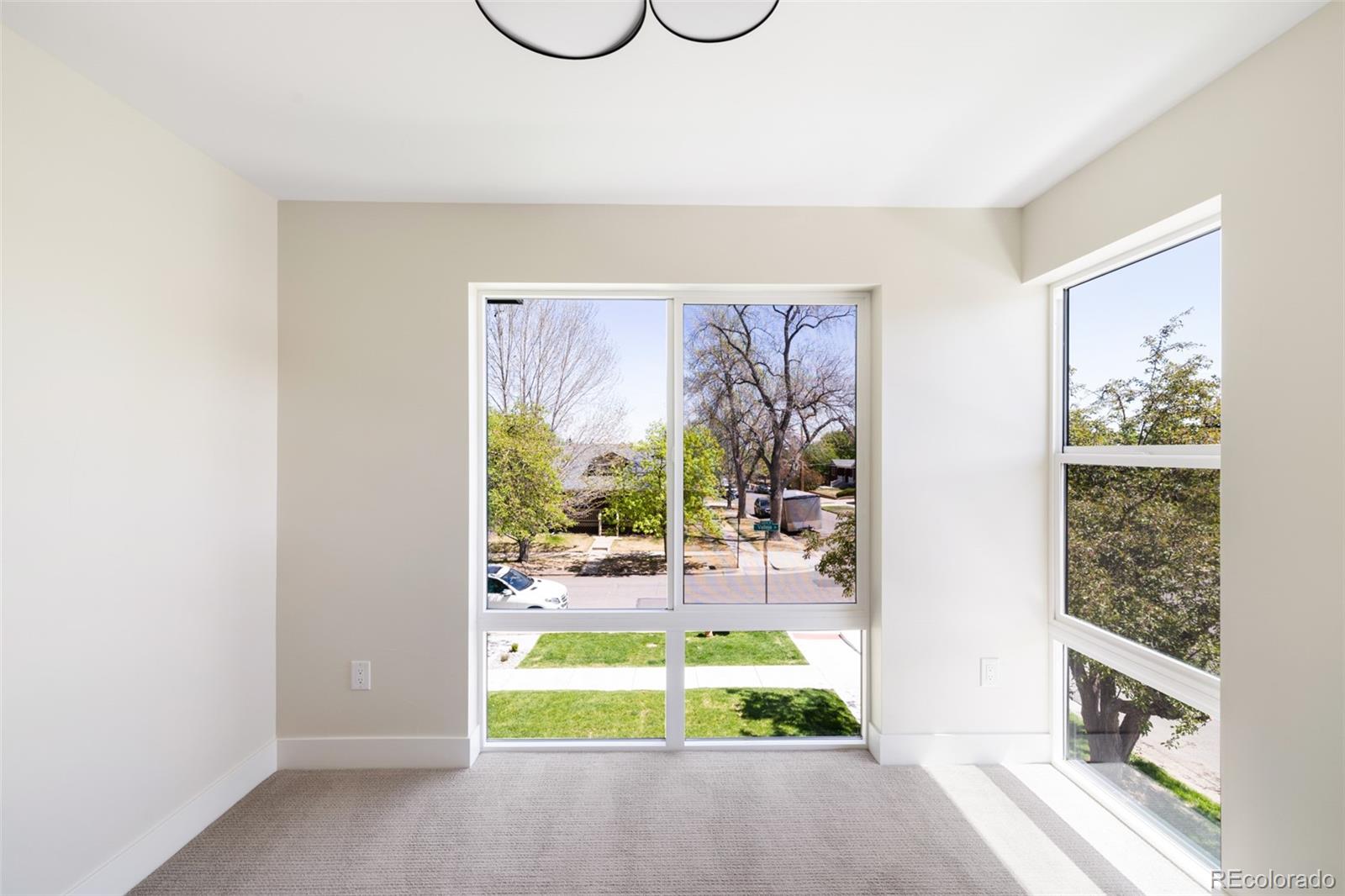 2203 West 37th Avenue Denver, CO 80211 - Photo 11 of 26 a view of a room with furniture and a window