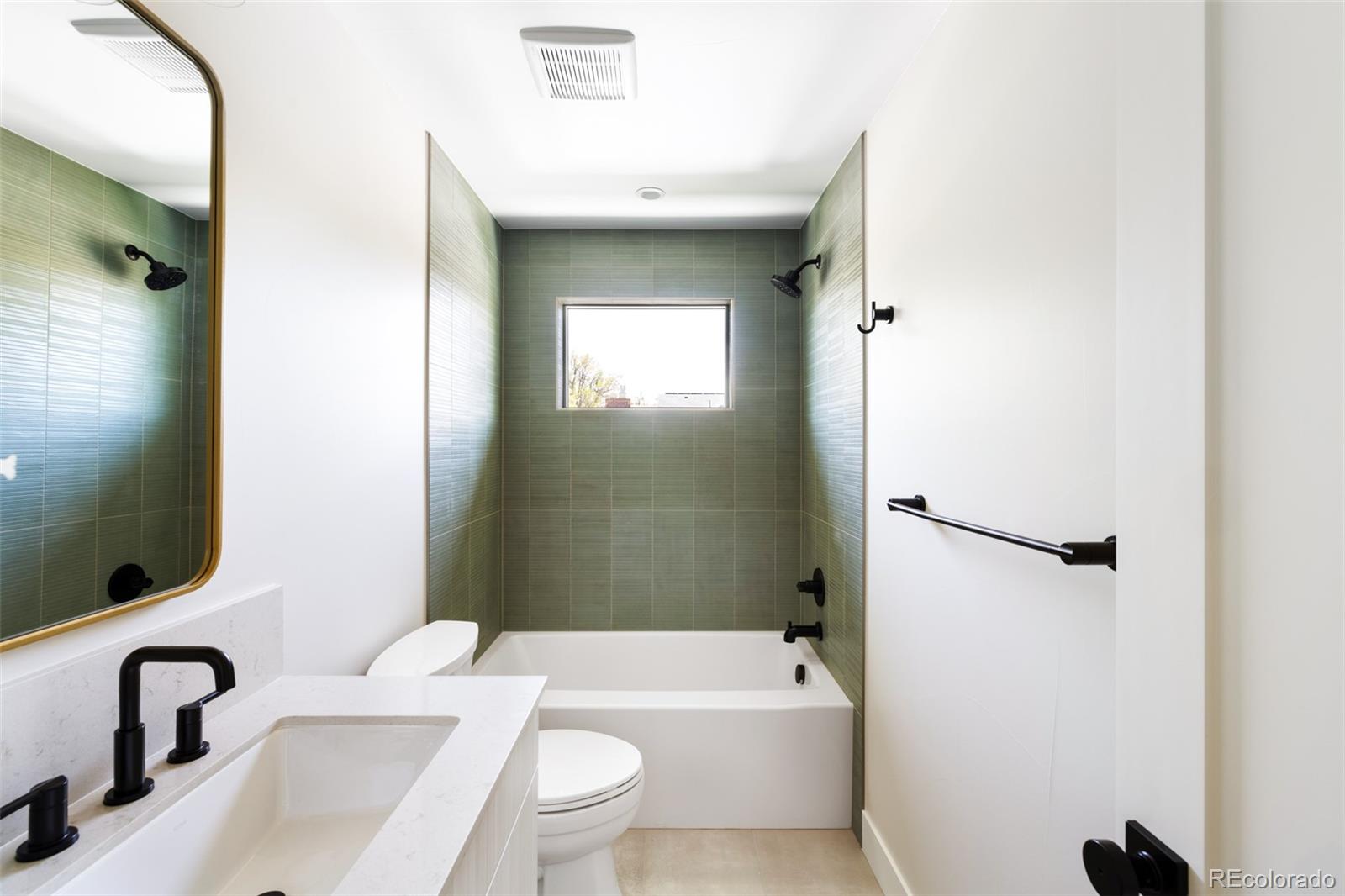 2203 West 37th Avenue Denver, CO 80211 - Photo 12 of 26 a bathroom with a toilet sink and bathtub
