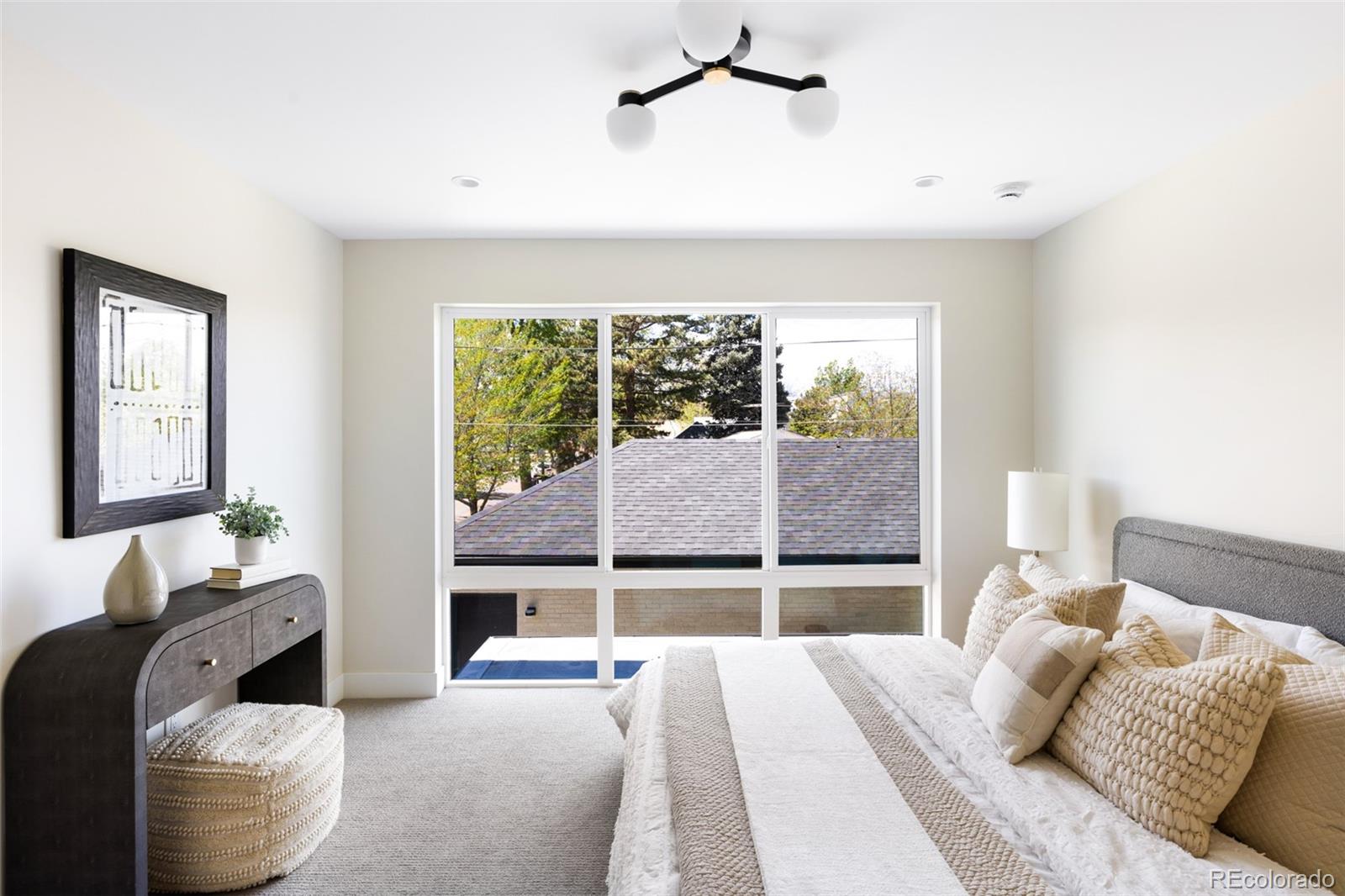 2203 West 37th Avenue Denver, CO 80211 - Photo 15 of 26 a bedroom with furniture and a window