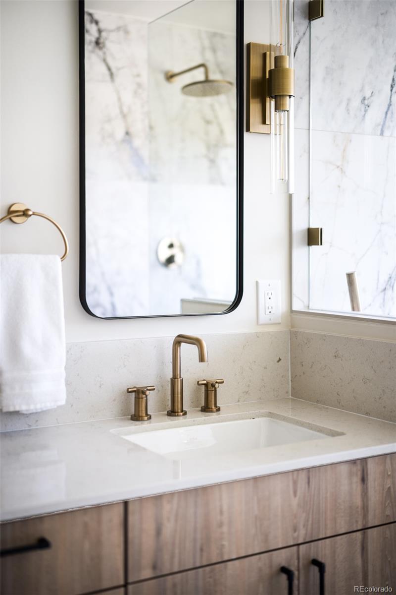 2203 West 37th Avenue Denver, CO 80211 - Photo 17 of 26 a bathroom with a sink and a mirror