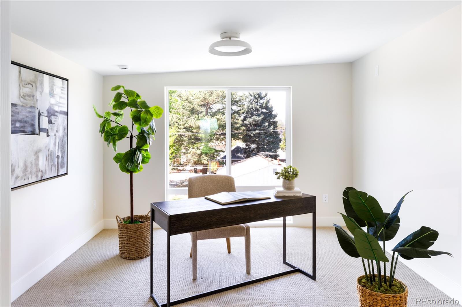 2203 West 37th Avenue Denver, CO 80211 - Photo 19 of 26 a living room with furniture and a potted plant
