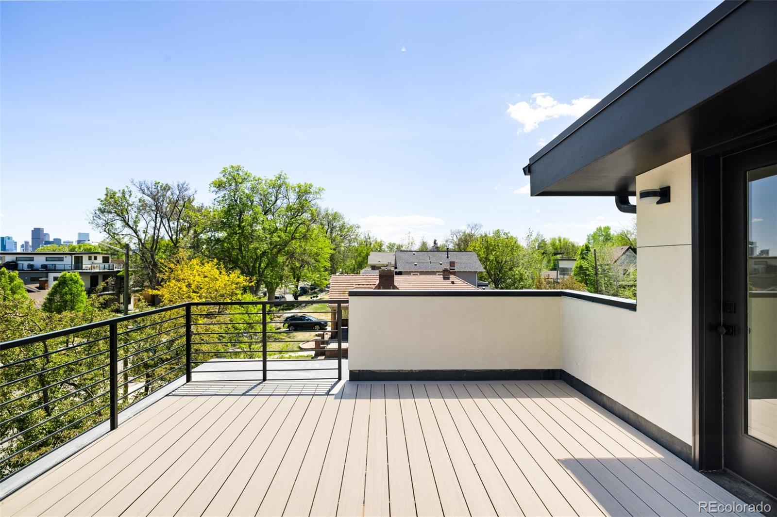 2203 West 37th Avenue Denver, CO 80211 - Photo 22 of 26 a view of balcony with wooden floor and seating space
