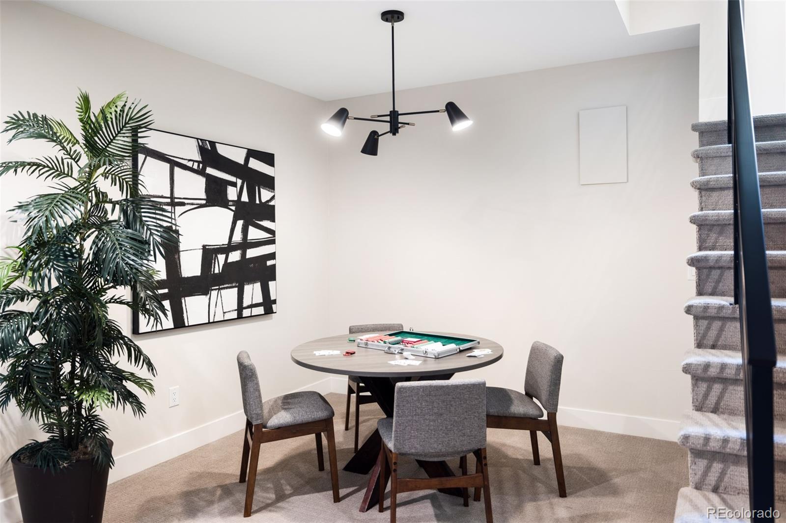 2203 West 37th Avenue Denver, CO 80211 - Photo 25 of 26 a view of a dining room with furniture and wooden floor