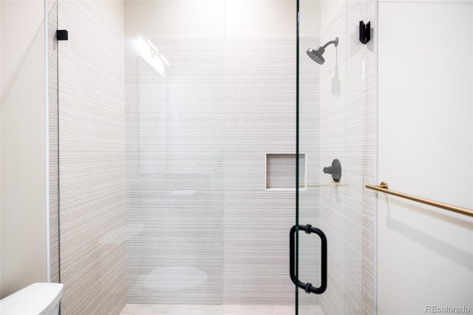 2203 West 37th Avenue Denver, CO 80211 - Photo 26 of 26 a bathroom with a shower