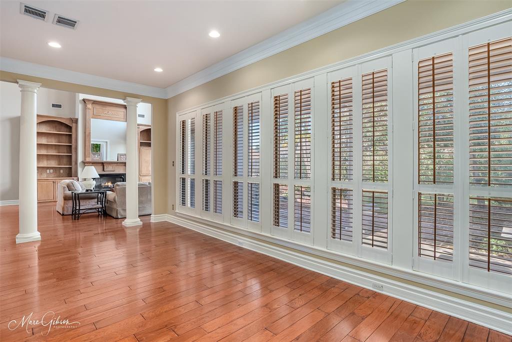 1069 Waters Edge Circle Shreveport, LA 71106 - Photo 12 of 35 a view of an empty room with a window and wooden floor