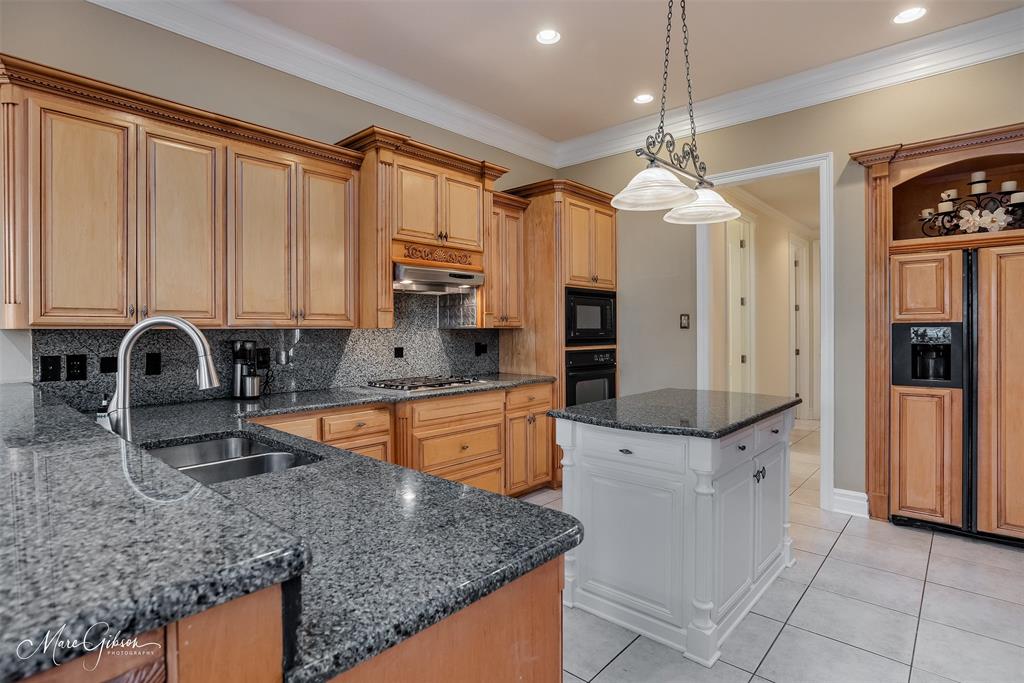 1069 Waters Edge Circle Shreveport, LA 71106 - Photo 14 of 35 a kitchen with stainless steel appliances granite countertop a sink a stove and a refrigerator