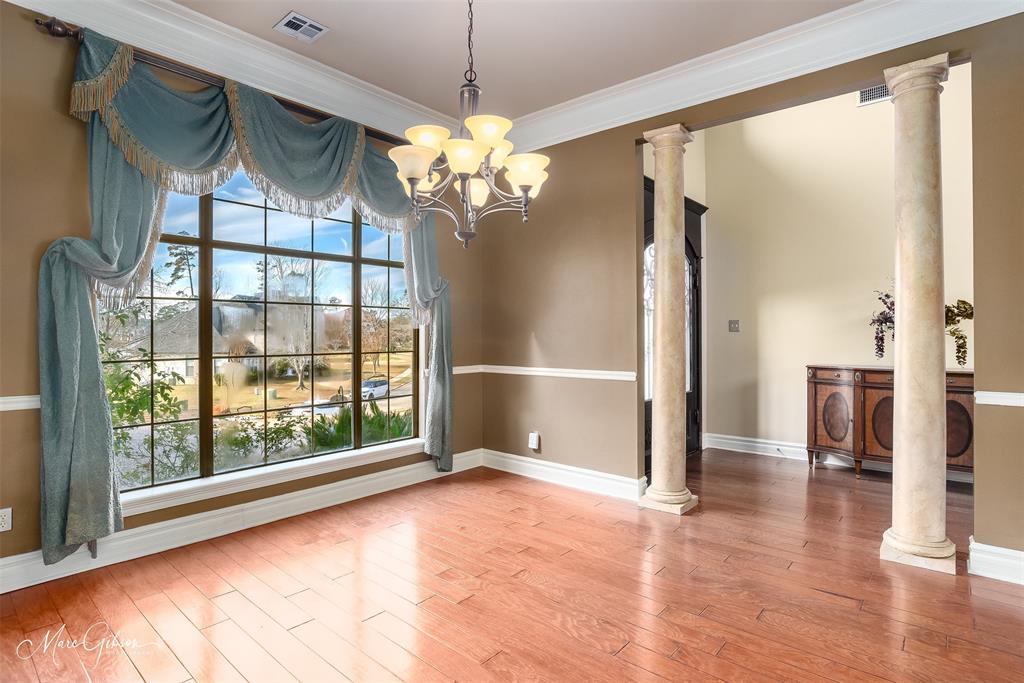 1069 Waters Edge Circle Shreveport, LA 71106 - Photo 17 of 35 a view of a livingroom with a chandelier a ceiling fan and front door