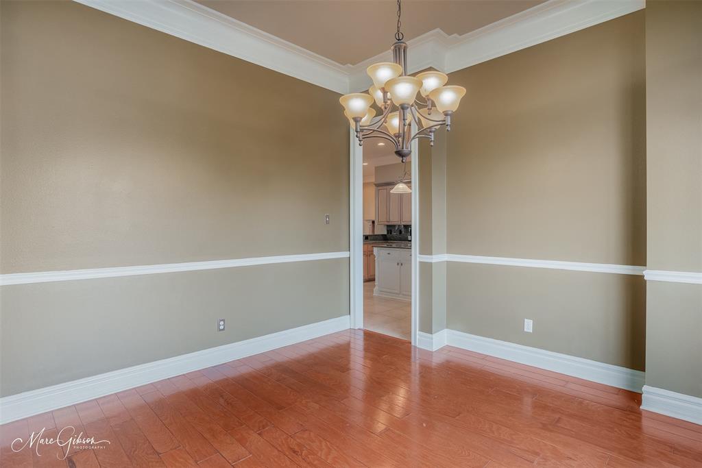 1069 Waters Edge Circle Shreveport, LA 71106 - Photo 18 of 35 en empty room with wooden floor
