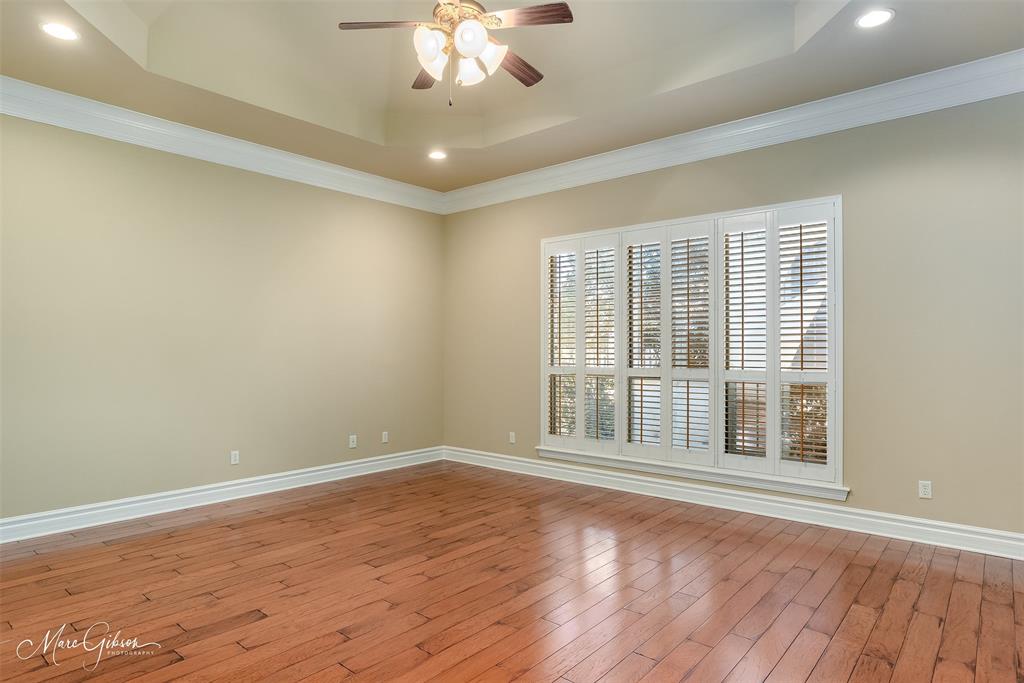 1069 Waters Edge Circle Shreveport, LA 71106 - Photo 22 of 35 a view of an empty room with wooden floor and a window