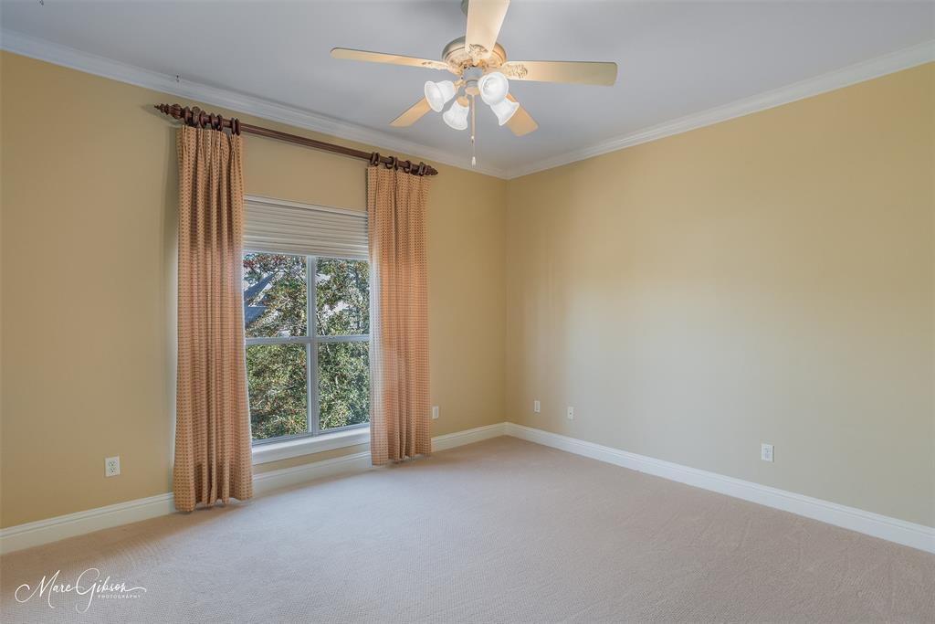 1069 Waters Edge Circle Shreveport, LA 71106 - Photo 32 of 35 an empty room with a window and a fan