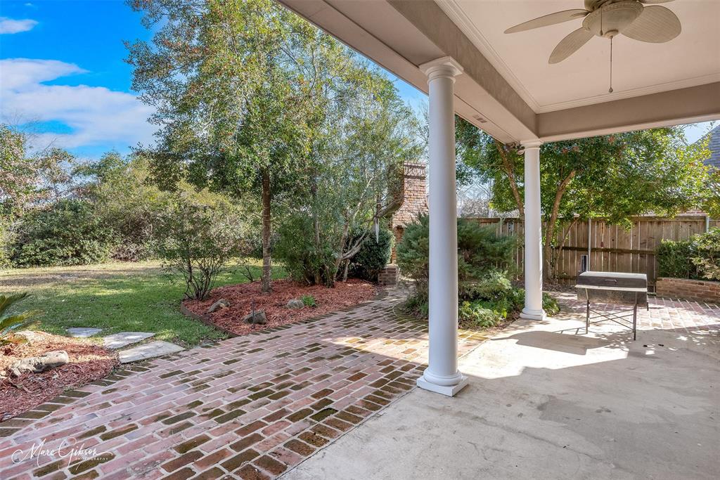 1069 Waters Edge Circle Shreveport, LA 71106 - Photo 7 of 35 a view of a patio with a table chairs and backyard