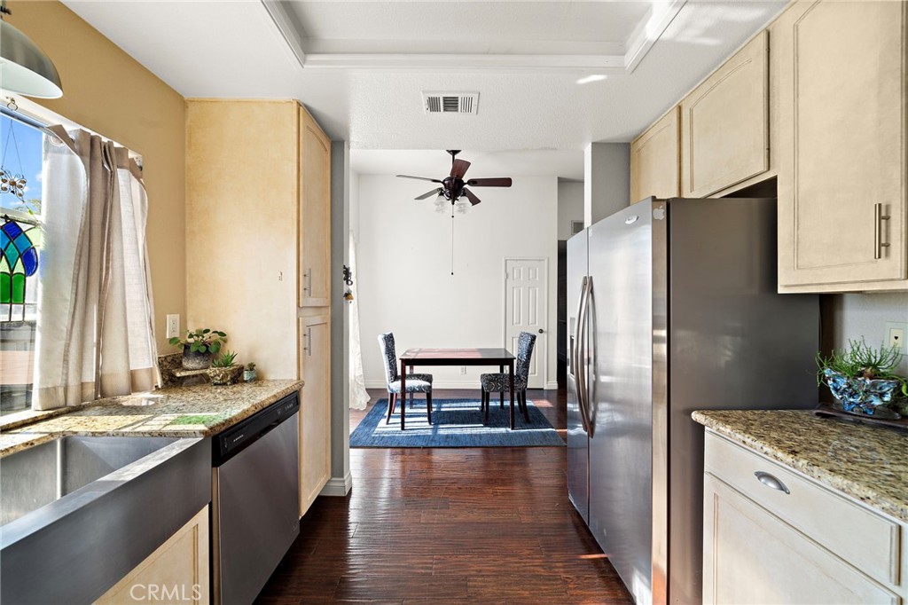32 Vía Contento Rancho Santa Margarita, CA 92688 - Photo 11 of 33 a kitchen with stainless steel appliances granite countertop a refrigerator a stove and a sink