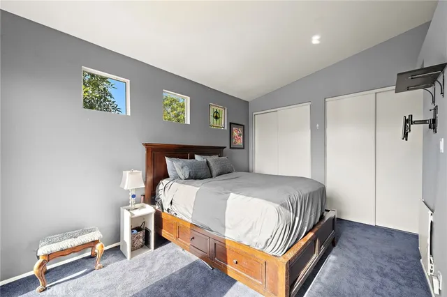 a bedroom with bed and a window