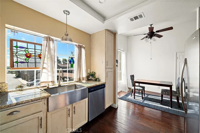 a very nice looking living room with wooden floor and a window